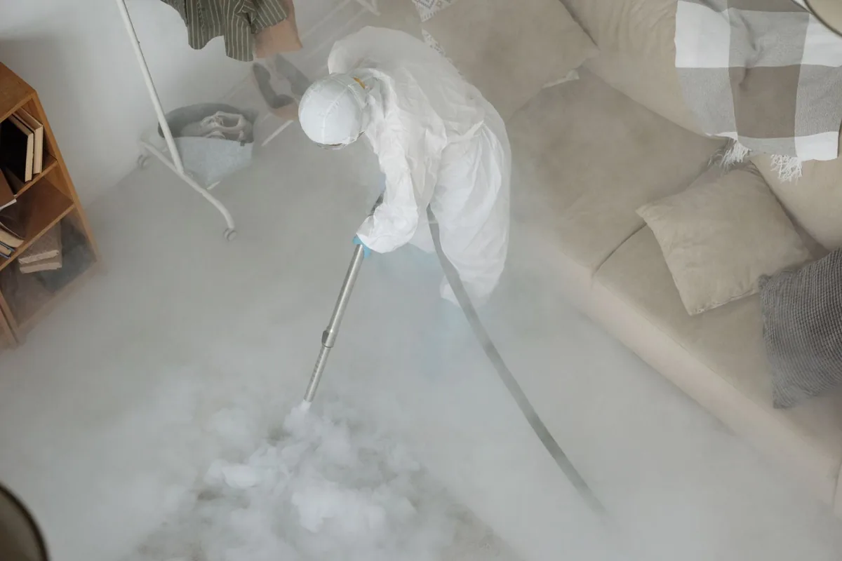 Biohazard cleanup technician in protective equipment, Chenango Bridge, NY